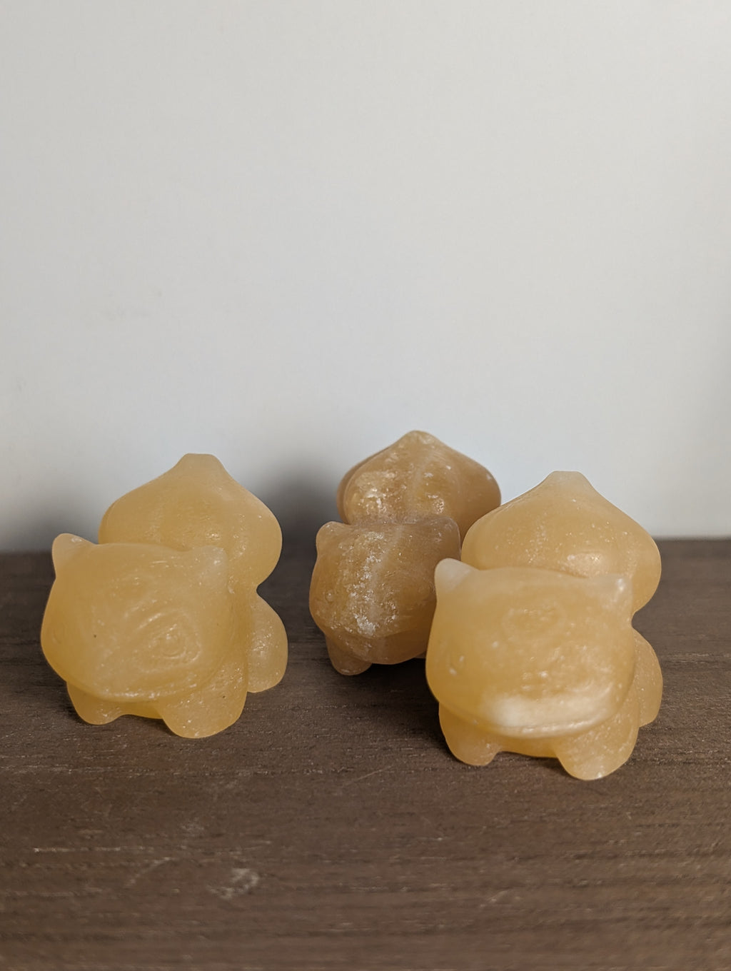 Hand-carved Bulbasaur crystal figurine by Syn's Crystal Co, a gemstone carving representing growth, nature, and heart chakra.