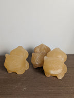 Hand-carved Bulbasaur crystal figurine by Syn's Crystal Co, a gemstone carving representing growth, nature, and heart chakra.