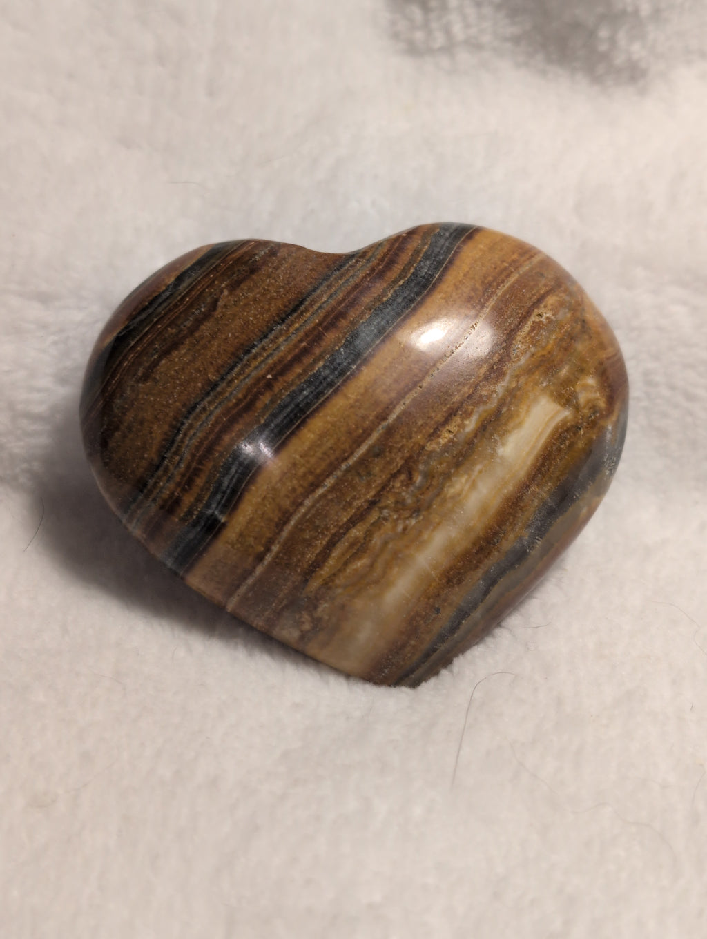 Bumblebee Calcite heart crystal from Syn's Crystal Co, showing vibrant yellow and black banded mineral with polished smooth surface.