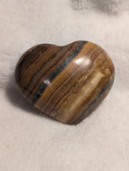 Bumblebee Calcite heart crystal from Syn's Crystal Co, showing vibrant yellow and black banded mineral with polished smooth surface.