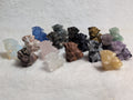 Mini Vulpix Pokémon carving by Syn's Crystal Co, featuring a detailed crystal sculpture of the fire-type Pokémon.
