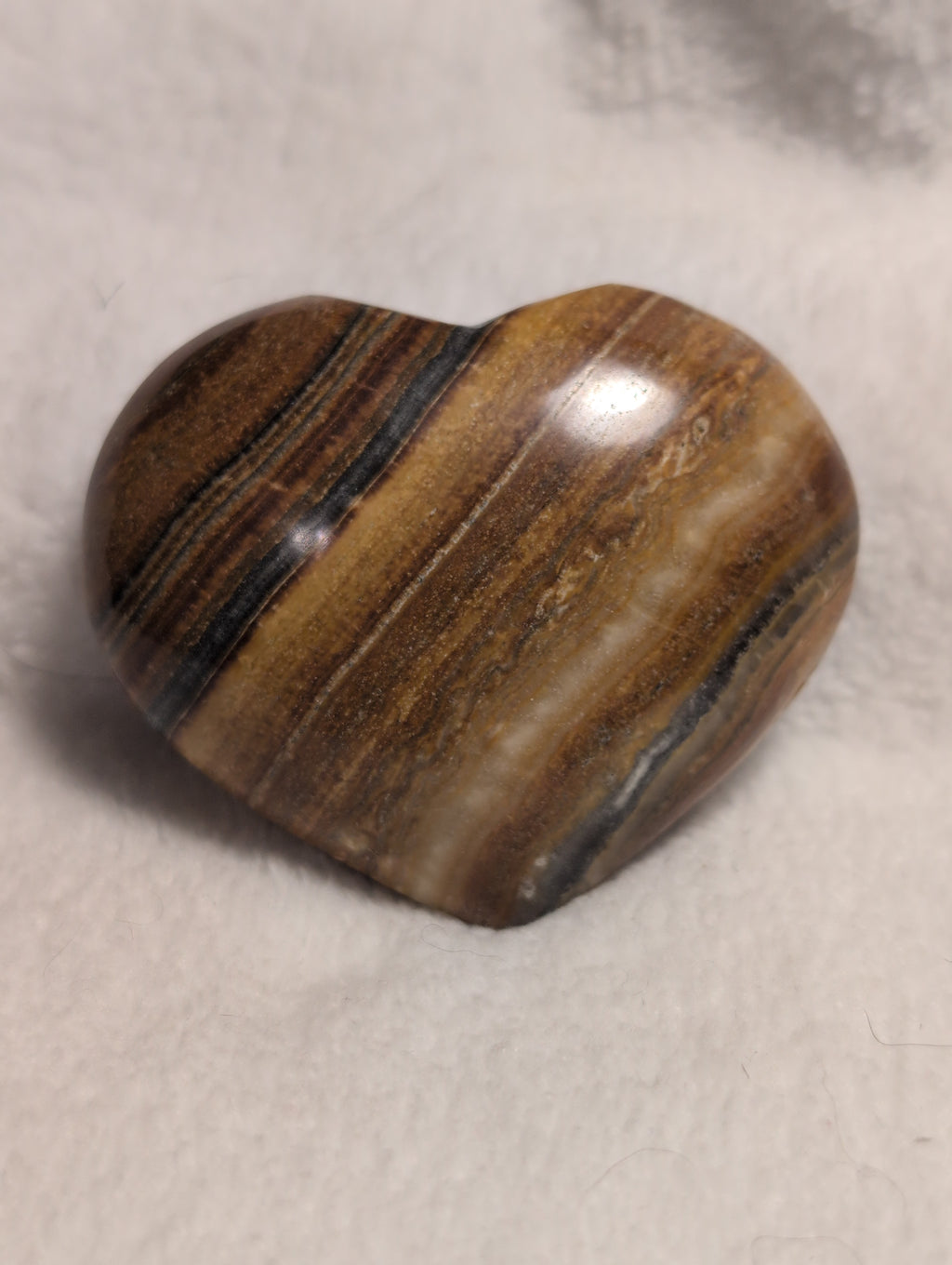 Bumblebee Calcite Heart from Syn's Crystal Co featuring vibrant yellow and black calcite patterns on a polished heart-shaped stone.