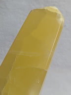 Yellow Lemon Calcite crystal tower from Syn's Crystal Co, featuring a pointed design to activate the Solar Plexus Chakra and boost confidence.