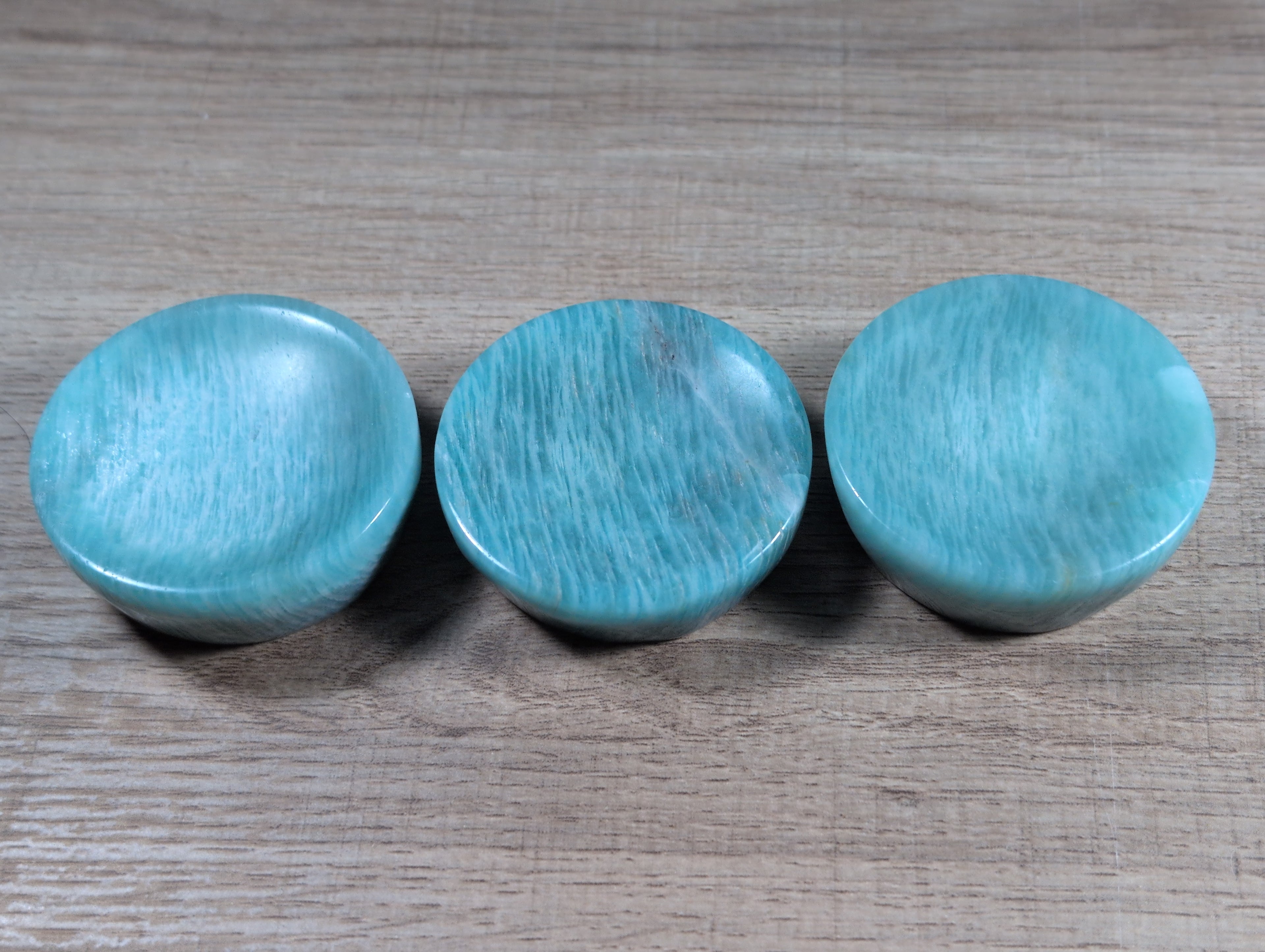 Round Amazonite bowl from Syn's Crystal Co featuring smooth, polished blue-green stone with natural mineral patterns.