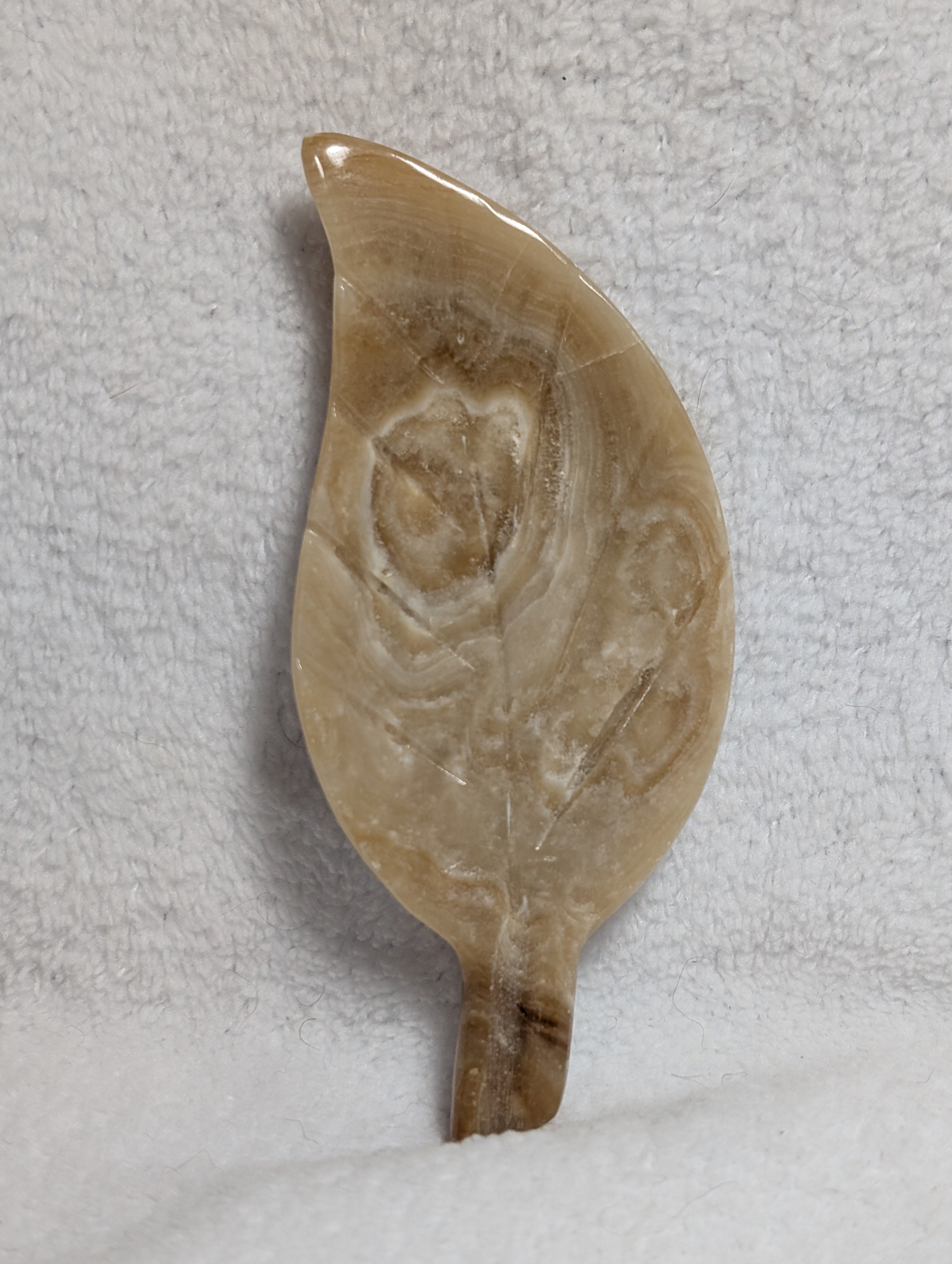 Chocolate Calcite Leaf carving by Syn's Crystal Co, showcasing intricate leaf details in rich chocolate-brown calcite.