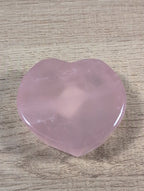Heart-shaped rose quartz bowl from Syn's Crystal Co, featuring a smooth pink gemstone with a polished finish.