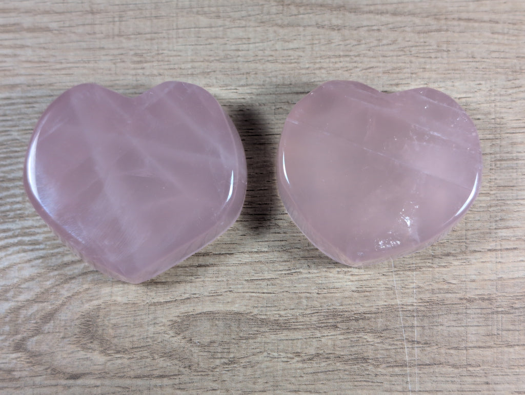 Heart-shaped rose quartz bowl by Syn's Crystal Co, featuring smooth pink gemstone with polished surface and intricate heart design.
