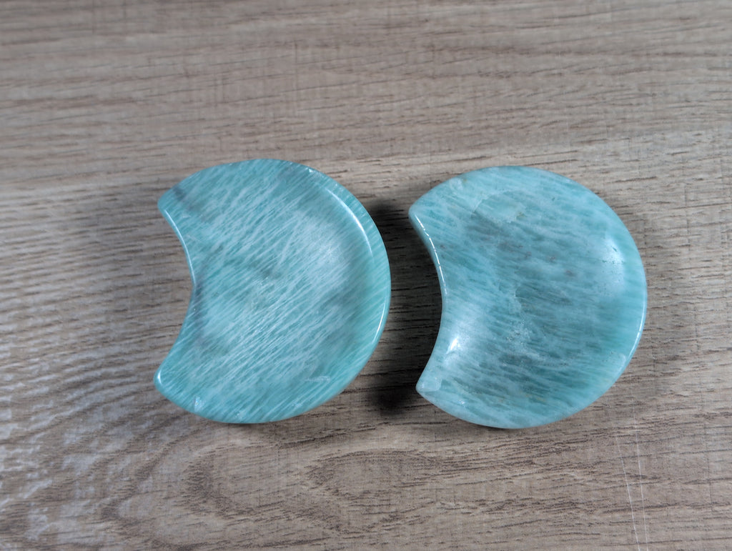 Half-moon shaped Amazonite bowl from Syn's Crystal Co, featuring smooth, polished blue-green gemstone with natural patterns.