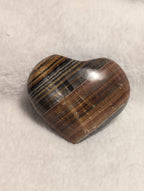 Pink Bumblebee Calcite heart pendant from Syn's Crystal Co, showing smooth polished surface and natural stone details.