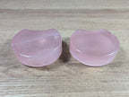Shaped rose quartz bowl from Syn's Crystal Co, smooth pink gemstone with rounded edges and polished surface.