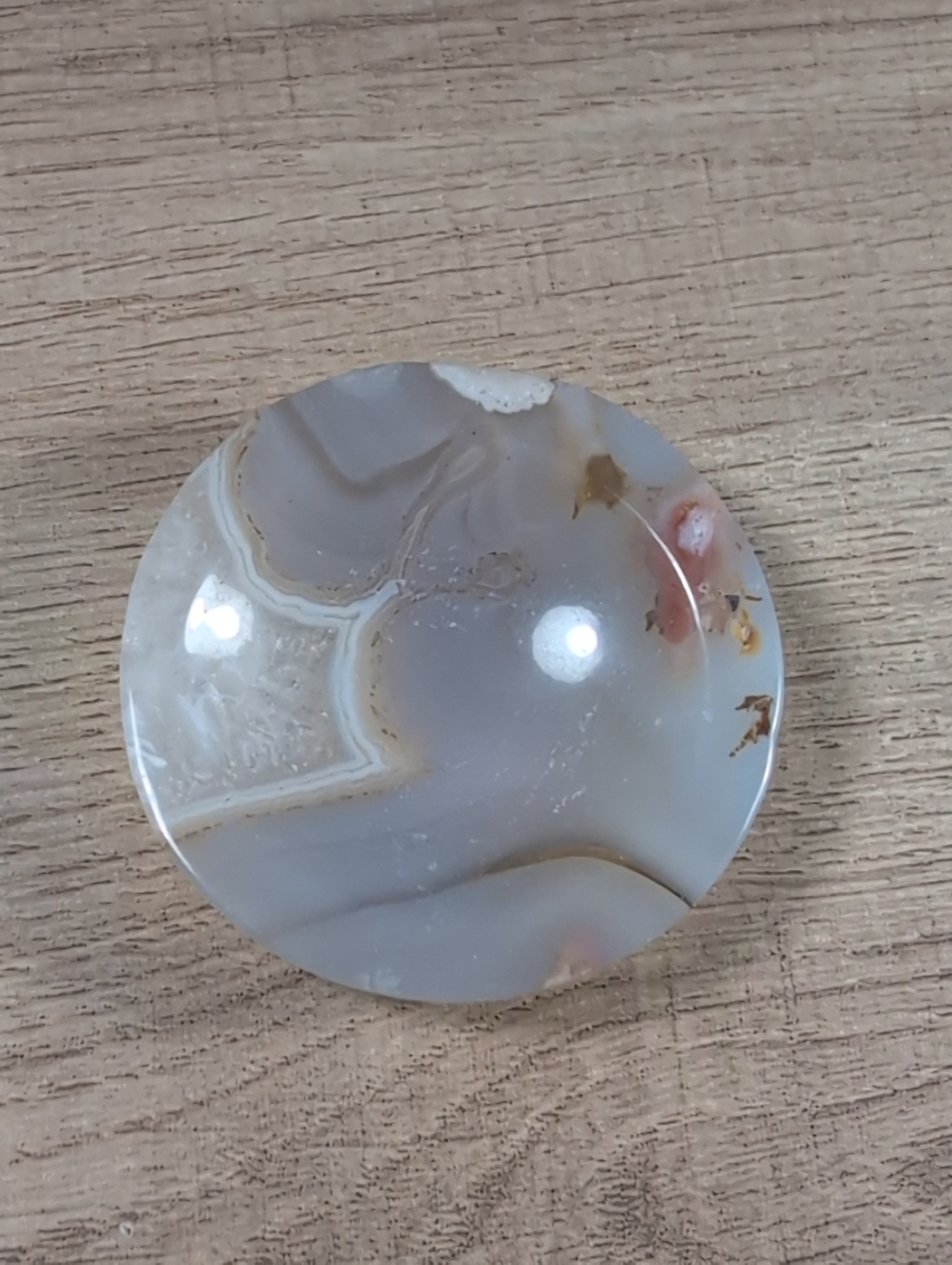 Round Flower Agate bowl from Syn's Crystal Co featuring vibrant floral patterns and polished, smooth stone surface.
