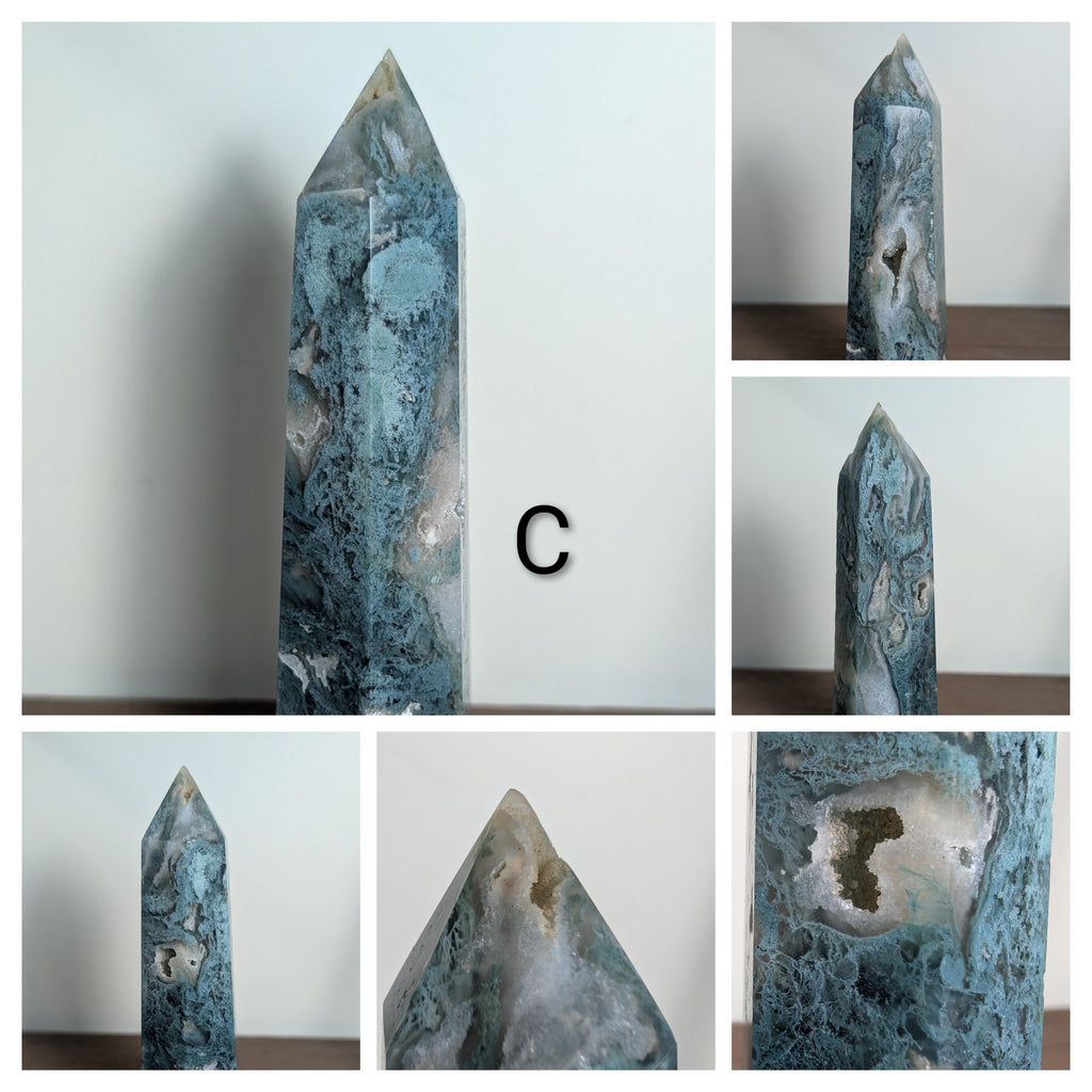 Natural moss agate crystal tower featuring green and brown patterns, used for grounding, growth, and abundance at the heart chakra.
