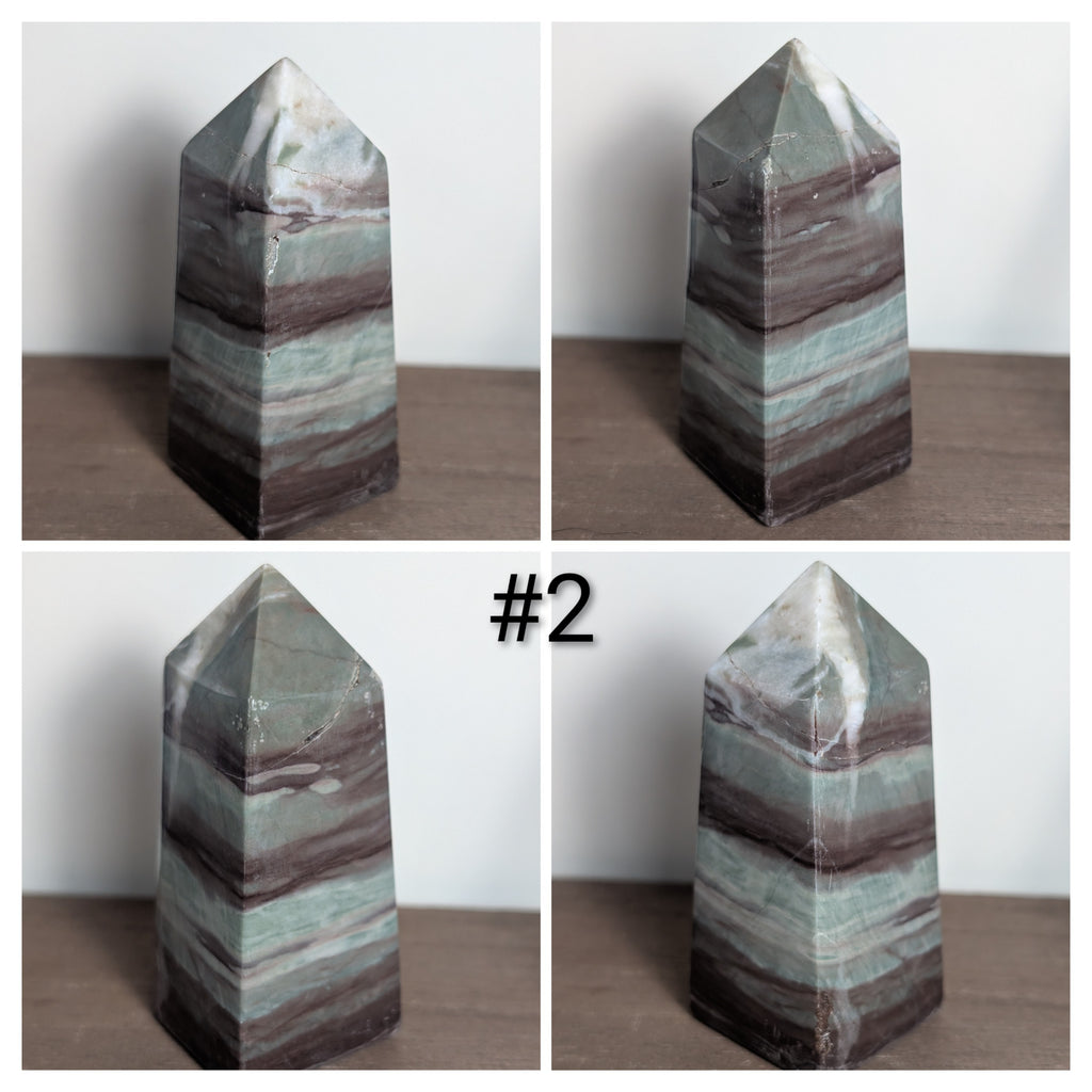 Green Liver Jasper tower crystal from Syn's Crystal Co, polished stone with natural banding and rich green hues.