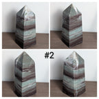 Green Liver Jasper tower crystal from Syn's Crystal Co, polished stone with natural banding and rich green hues.