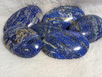 Lapis Lazuli palmstone from Syn's Crystal Co, polished blue stone with gold and white veining, smooth and rounded for meditation.