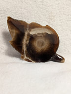 Chocolate Calcite Leaf gemstone from Syn's Crystal Co showing a polished chocolate brown calcite with leaf-like shape and natural texture.