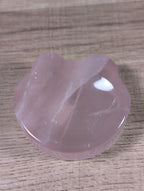 Rose quartz bowl shaped like a teddy bear head with detailed facial features, crafted by Syn's Crystal Co.