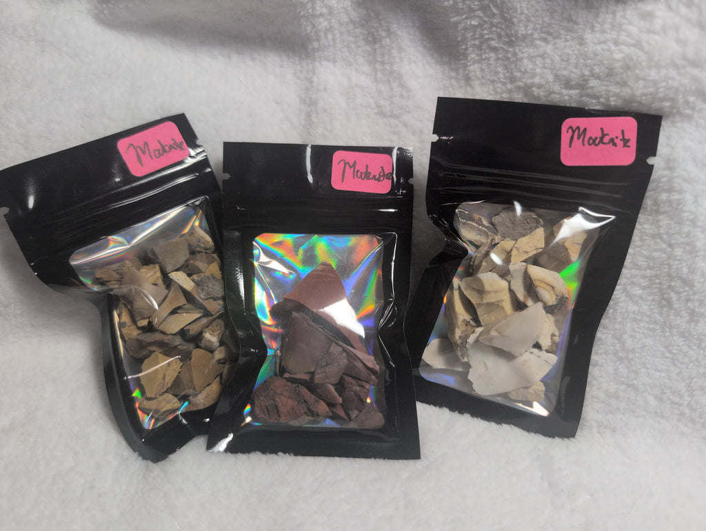 Bag of Mookaite Raw Crystal Chips from Syn's Crystal Co, showing colorful, polished gemstone pieces in a transparent plastic bag.