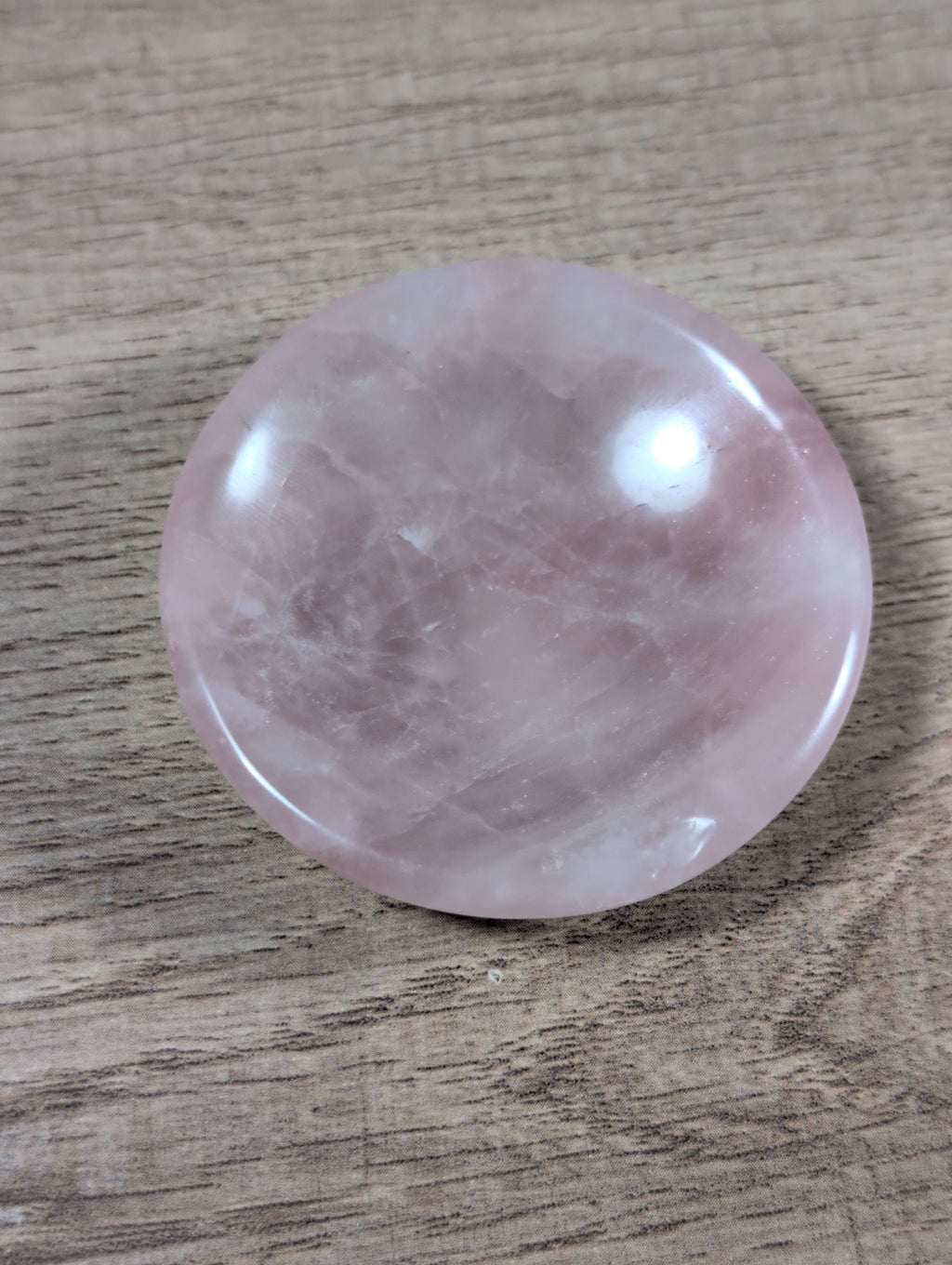 Round rose quartz bowl from Syn's Crystal Co, smooth pink gemstone with a polished finish and rounded shape.