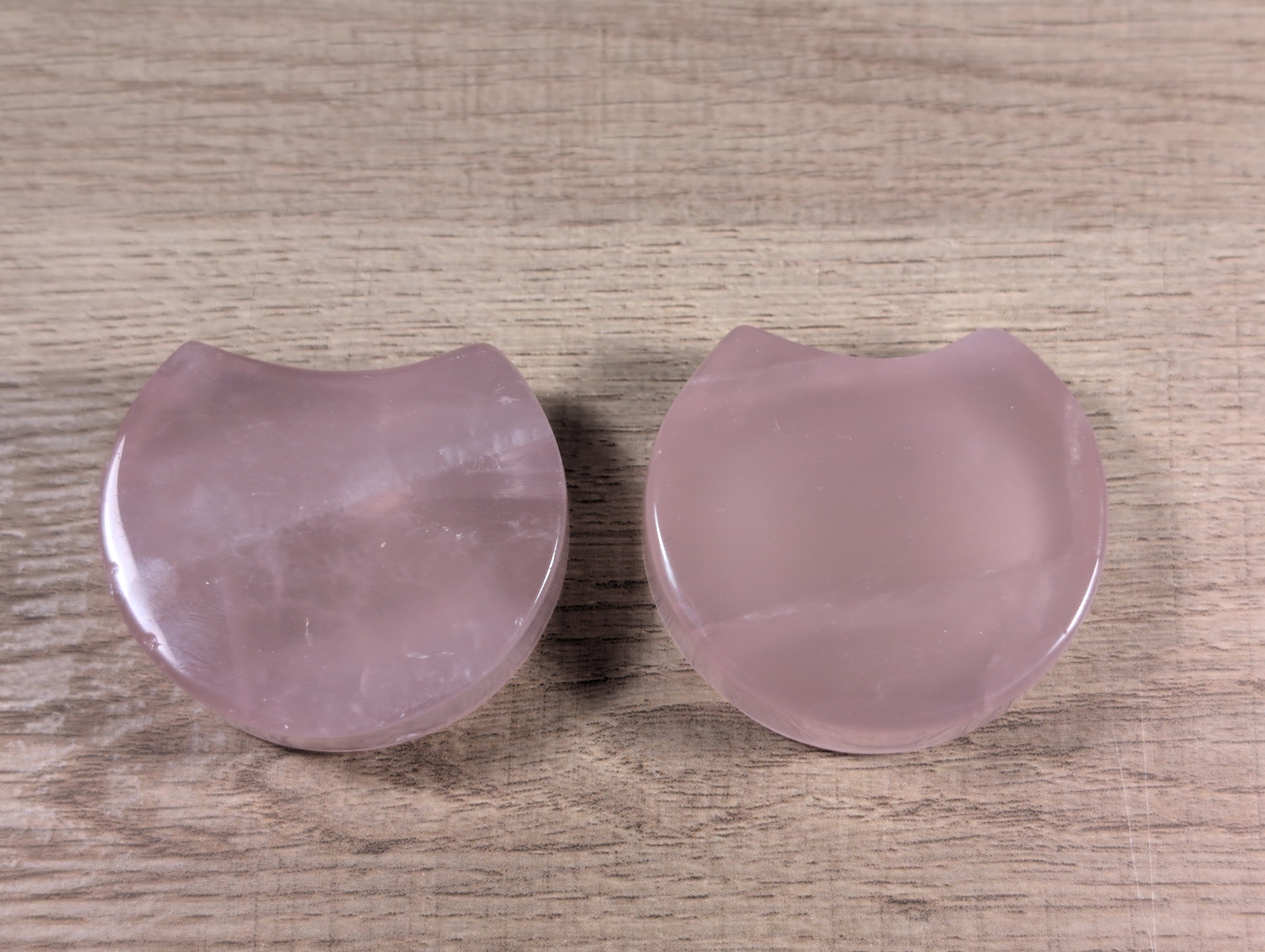 Shaped rose quartz bowl by Syn's Crystal Co, smooth polished pink gemstone with natural stone patterns and rounded edges.