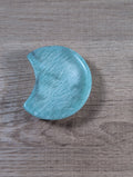 Half-moon shaped Amazonite bowl from Syn's Crystal Co, showcasing smooth, polished blue-green gemstone with natural patterns.