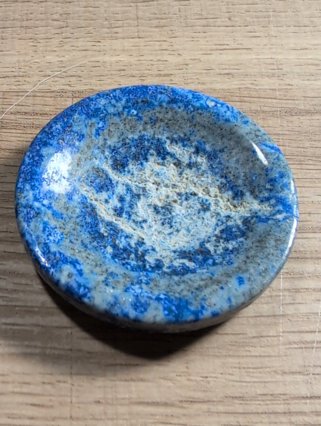 Lapis Lazuli crystal bowl by Syn's Crystal Co, natural blue gemstone dish with polished surface, ideal for decor and spiritual display.