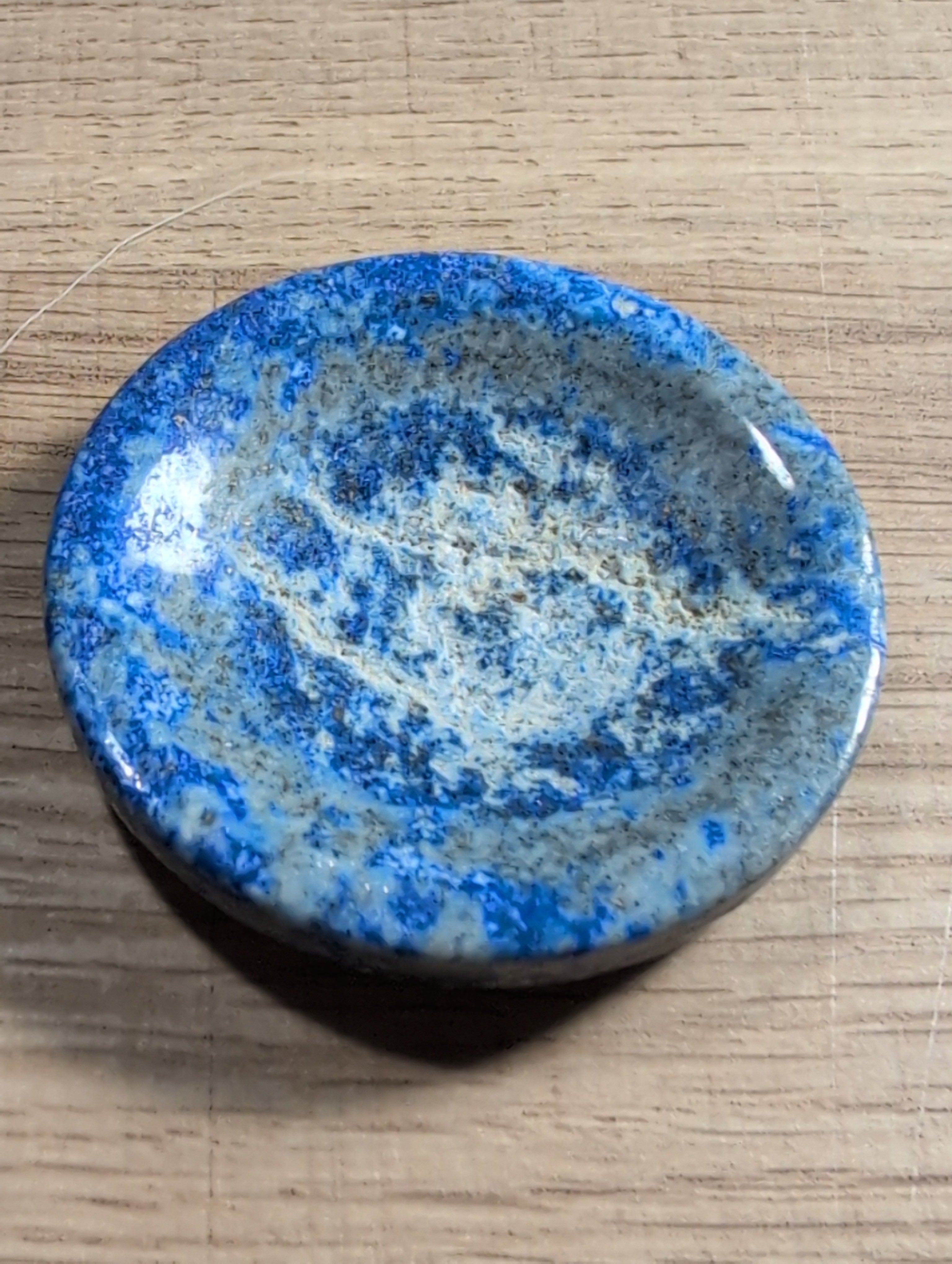 Lapis Lazuli crystal bowl by Syn's Crystal Co, natural blue gemstone dish with polished surface, ideal for decor and spiritual display.