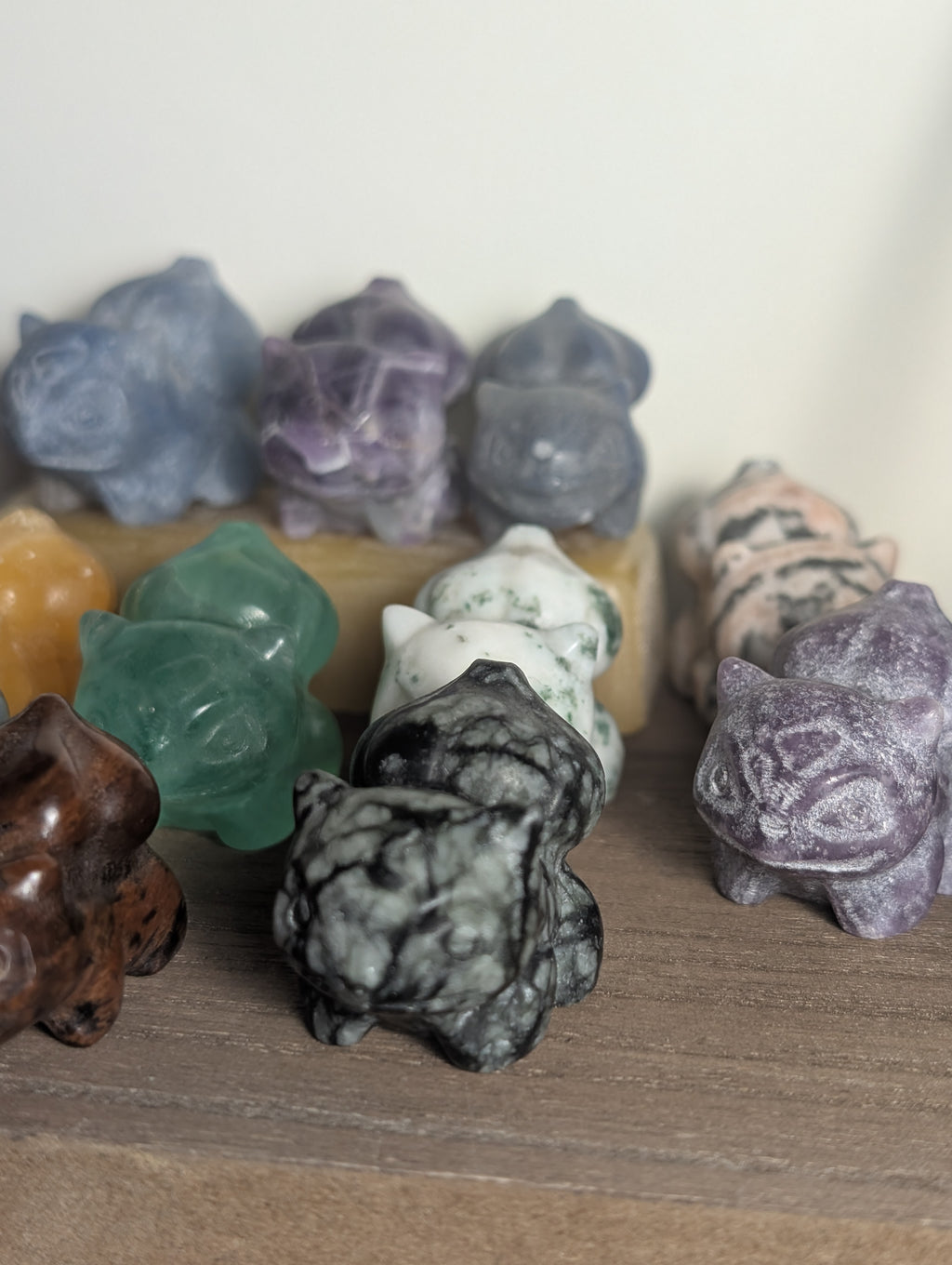 Hand-carved Bulbasaur crystal figurine by Syn's Crystal Co, showcasing detailed gemstone craftsmanship for nature and heart chakra.